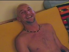 Sexy blonde gay jerks in front of cam