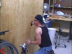 Stud sucking cock via glory hole