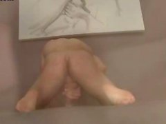 Pretty boy masturbating with a toy