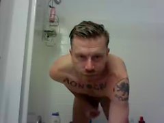 hunky tat man in shower