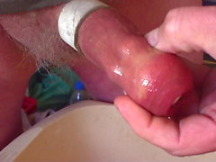 Piss with table tennis ball and 4 ball bearings in foreskin